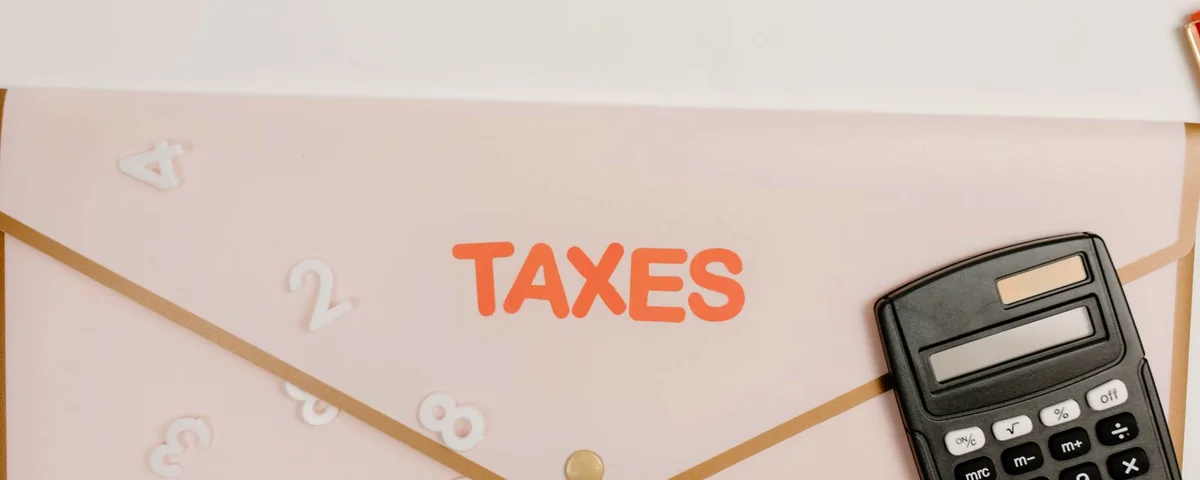 A tax folder next to a calculator